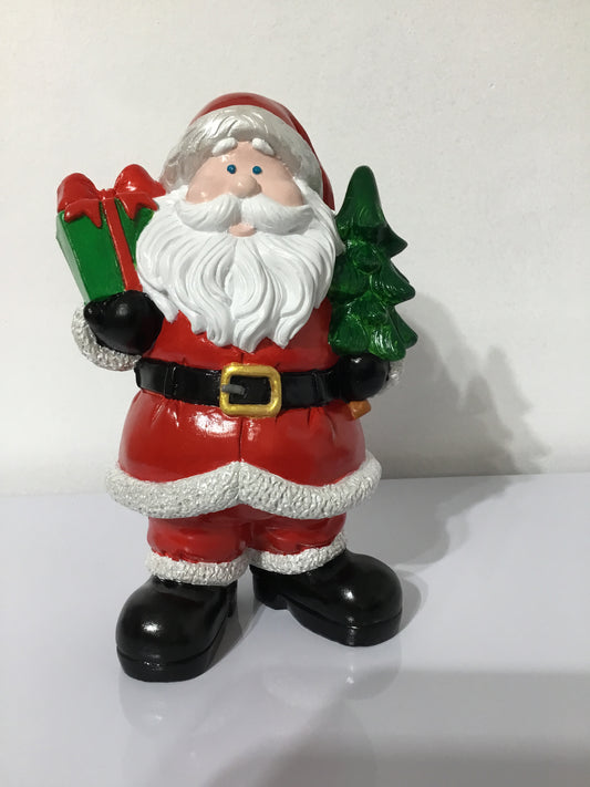 Santa Claus Holding Present and Tree